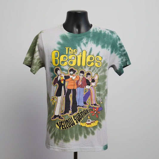 Tie-dye t-shirt with The Beatles Yellow Submarine graphic on a mannequin against a gray background