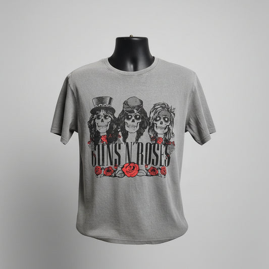 Gray Guns N Roses  top with graphic design of skulls and roses on a store shelf background