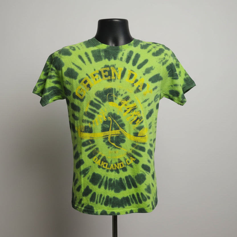 Green and black tie-dye GREEN DAY, Oakland, CA tee on mannequin