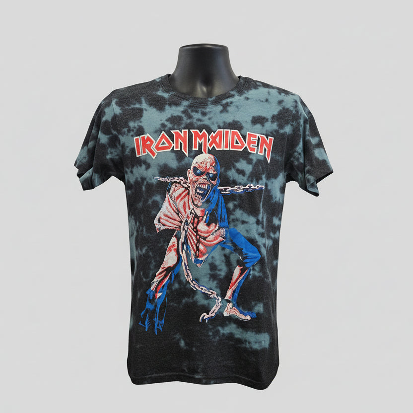 Tie-dye t-shirt with Iron Maiden logo and Eddie graphic on a mannequin against a gray background