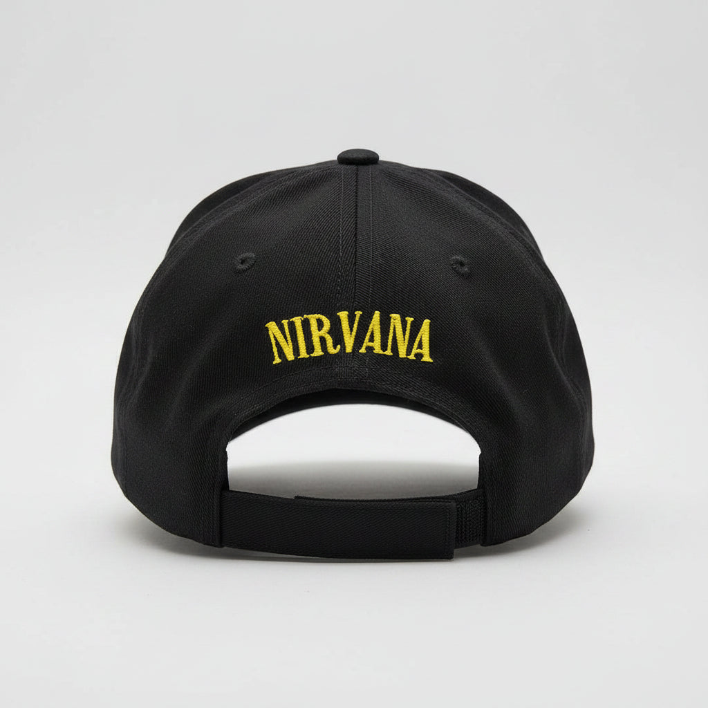 Black cap with 'Nirvana' embroidered in yellow on a light gray background