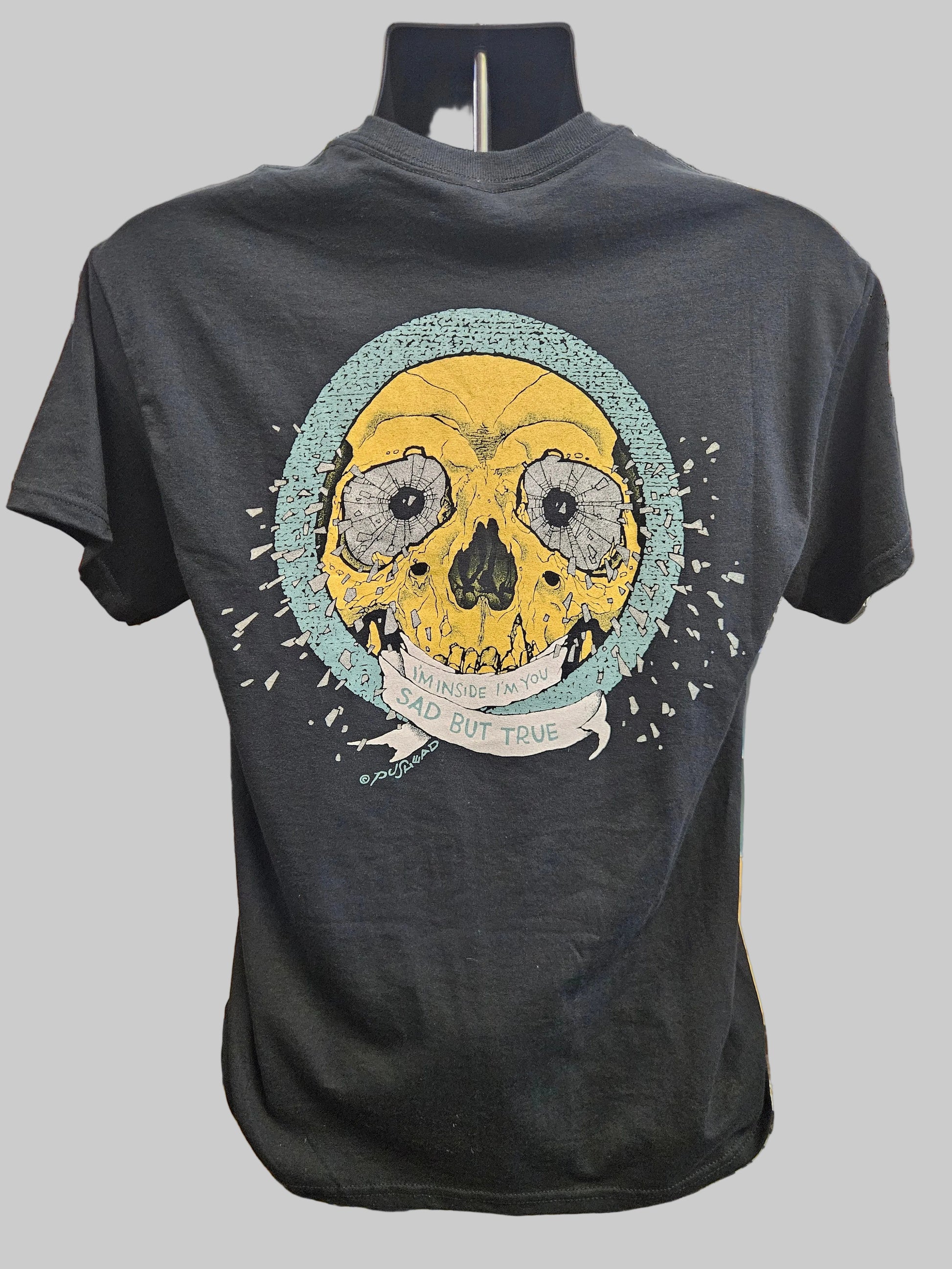 Gray Metallica t-shirt with a skull graphic on a gray background