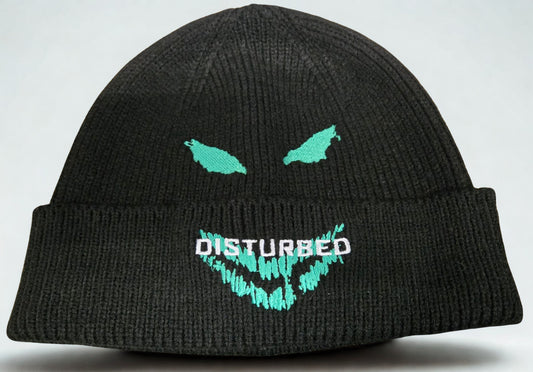 Black beanie with teal and white graphics and 'DISTURBED' text on a gray background