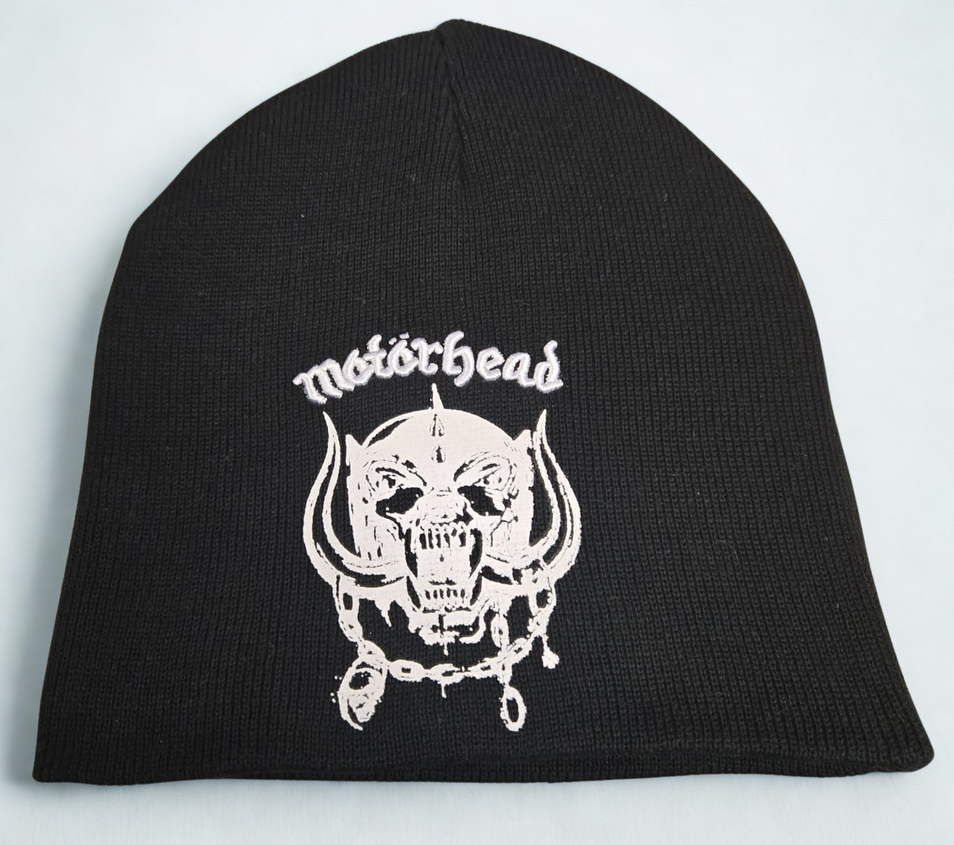Black beanie with white 'Motorhead' logo on a light gray background