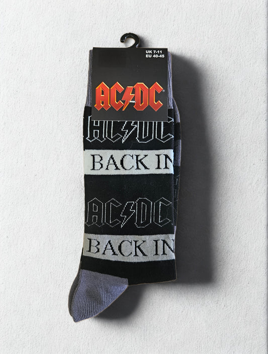 AC/DC socks with logo and text on a light gray background