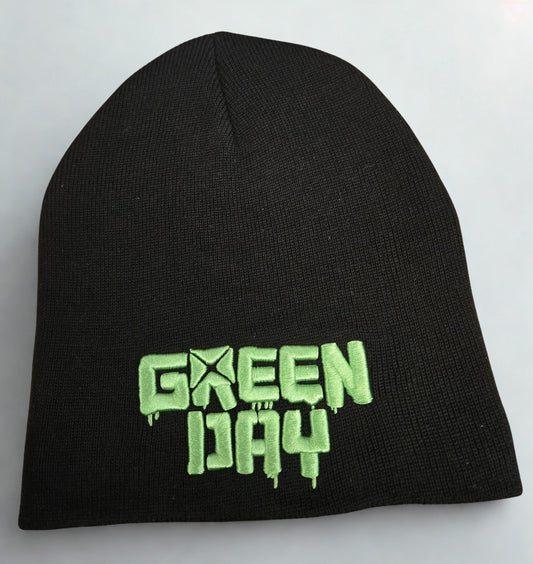 Black beanie with green 'Green Day' text on a white background
