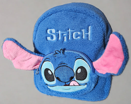 Blue plush bag with 'Stitch' face design on a gray background