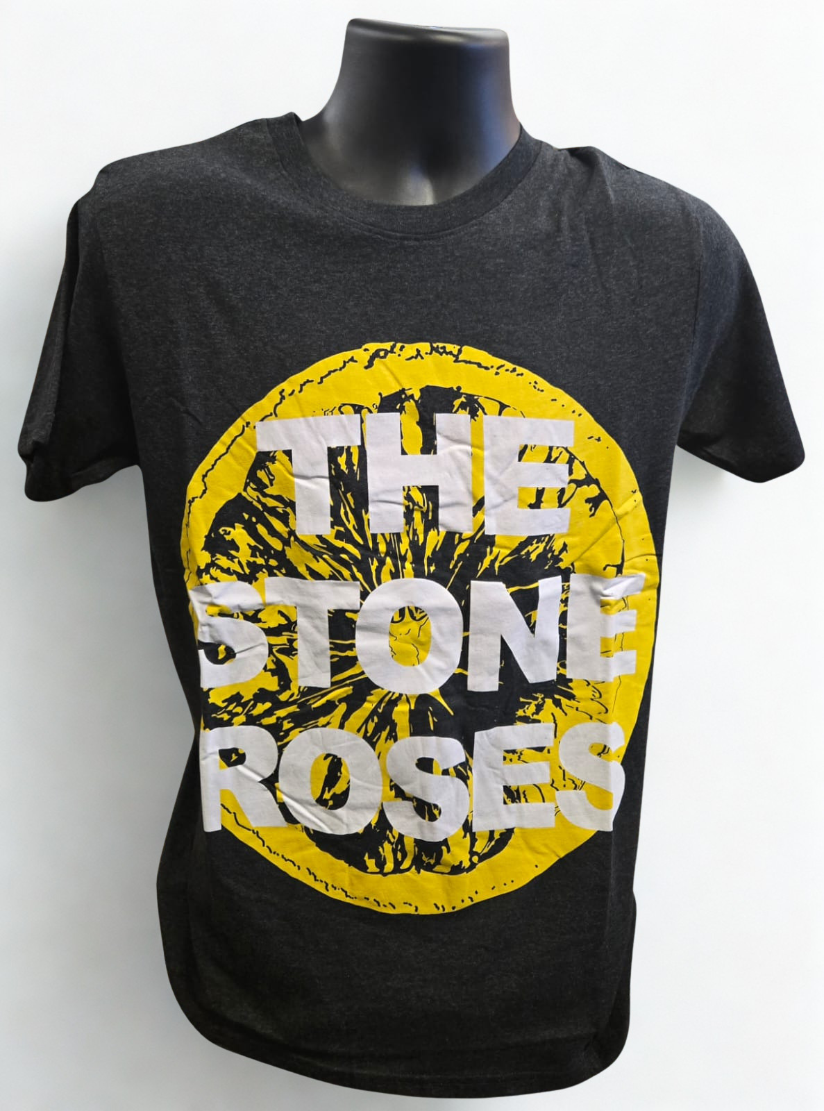 Black t-shirt with 'The Stone Roses' graphic design on a mannequin against a white background